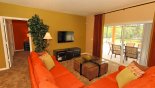 Villa rentals in Orlando, check out the Family room with direct access & views onto pool deck with flat screen TV