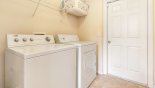 Villa rentals near Disney direct with owner, check out the Laundry room leading to games room with washer, dryer, iron & ironing board