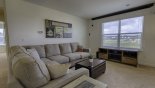 Upstairs sitting area with projection screen retracted with this Orlando Villa for rent direct from owner