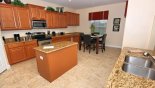 Fully fitted kitchen with granite countertops - www.iwantavilla.com is the best in Orlando vacation Villa rentals