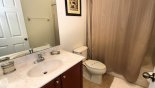 Family bathroom with bath & shower over, sink & WC - www.iwantavilla.com is the best in Orlando vacation Villa rentals