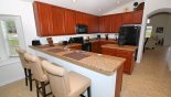 Fully fitted kitchen with breakfast bar & 3 bar stools from Cape San Blas 8 Villa for rent in Orlando