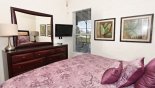 Ground floor king bedroom #6 with flat screen TV with this Orlando Villa for rent direct from owner