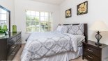 Ground floor bedroom #5 with queen sized bed & views over front gardens with this Orlando Villa for rent direct from owner