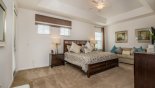 Villa rentals in Orlando, check out the Master bedroom with king sized bed & LCD TV