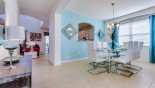 Spacious rental Watersong Resort Villa in Orlando complete with stunning View of dining area and hallway leading to family room