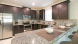 Luxury kitchen with granite counter tops and quality stainless steel appliances with this Orlando Villa for rent direct from owner