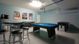 Games room with pool table, air hockey & table foosball - www.iwantavilla.com is the best in Orlando vacation Villa rentals