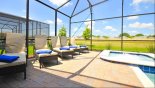 Pool deck with 6 sun loungers (1 out of view) - www.iwantavilla.com is the best in Orlando vacation Villa rentals