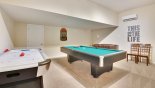 Games room with pool table, air hockey, table foosball, darts, putting green & air conditioning from Brentwood 1 Villa for rent in Orlando