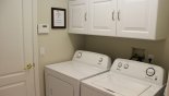 Laundry room with washer, dryer, iron & ironing board from Highlands Reserve rental Villa direct from owner