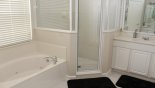 Master #1 ensuite bathroom with corner bath, walk-in shower. his & hers sinks & separate WC - www.iwantavilla.com is the best in Orlando vacation Villa rentals