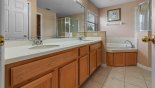 Master #1 ensuite bathroom with Roman bath, his & hers sinks, large walk-in shower & separate WC from Highlands Reserve rental Villa direct from owner