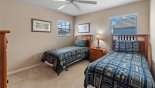 Villa rentals in Orlando, check out the Bedroom #2 with twin sized beds and views onto pool deck
