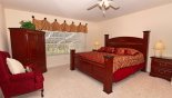 Master 1 bedroom with king sized bed & cabinet mounted cable TV - www.iwantavilla.com is the best in Orlando vacation Villa rentals