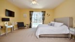 Master bedroom with large LCD TV - www.iwantavilla.com is your first choice of Villa rentals in Orlando direct with owner