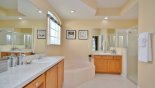 Master ensuite with corner bath and large shower - www.iwantavilla.com is the best in Orlando vacation Villa rentals