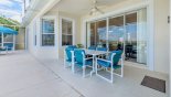 Covered lanai with patio table & 6 chairs - additional patio table with parasol & 2 chairs - www.iwantavilla.com is your first choice of Villa rentals in Orlando direct with owner