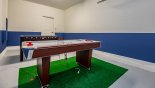 Games room with air hockey & table foosball from Majesty Palm 4 Villa for rent in Orlando