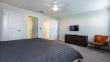 Master 1 bedroom with wall mounted LCD cable TV - www.iwantavilla.com is the best in Orlando vacation Villa rentals
