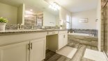 Spacious rental Solterra Resort Villa in Orlando complete with stunning Master 1 ensuite bathroom with Roman bath, his & hers sinks, large walk-in shower & separate WC