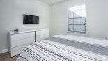 Bedroom 5 with wall mounted LCD cable TV from Majesty Palm 5 Villa for rent in Orlando