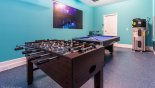 Games room with pool table & table foosball - www.iwantavilla.com is the best in Orlando vacation Villa rentals