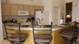Villa rentals in Orlando, check out the Kitchen breakfast bar with 4 bar stools - great for socializing around the kitchen