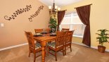 Dining area adjacent to living room seating 6 persons from Cape San Blas 2 Villa for rent in Orlando
