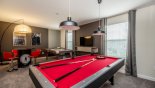Games room with pool table, air hockey and large LCD cable TV - www.iwantavilla.com is the best in Orlando vacation Villa rentals