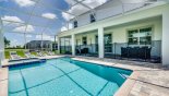 Spacious rental Champions Gate Villa in Orlando complete with stunning View of pool & spa towards covered lanai