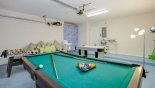 Games room with table foosball, pool table, air hockey & magnetic darts - www.iwantavilla.com is the best in Orlando vacation Villa rentals