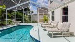 Spacious rental Highlands Reserve Villa in Orlando complete with stunning Pool deck with 6 sun loungers - 4 visible in this view