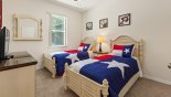 Bedroom #5 with twin beds & views over pool deck from Ridgewood Lakes rental Villa direct from owner