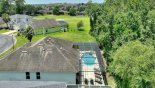 Winchester 1 Villa rental near Disney with Aerial view showing pool deck viewed towards direction of the lake around the corner after trees