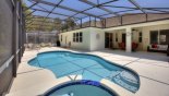 View of pool & spa towards covered lanai with this Orlando Villa for rent direct from owner