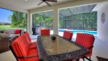 Villa rentals in Orlando, check out the Patio table with 6 comfortable chairs under shady lanai