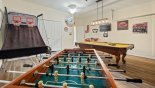 Games room with an pool table, table foosball, basketball game & wall-mounted 32