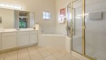 Master ensuite bathroom with bath, large walk-in shower, dual sinks & WC from Bahama Bay Resort rental Condo direct from owner