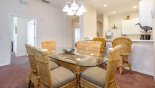Dining area, seating up to 8 people (6 at table and 2 on bar stools at breakfast bar with this Orlando Condo for rent direct from owner