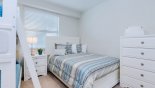 Condo rentals in Orlando, check out the Bedroom 2 with chest of drawers and nightstand