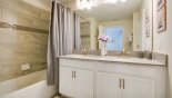 Master Bathroom 1 en suite with shower over bath, his & hers sinks & separate WC from Champions Gate rental Townhouse direct from owner