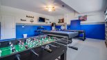 Games room with pool table (table tennis), air hockey. table foosball, darts & TV - www.iwantavilla.com is the best in Orlando vacation Villa rentals