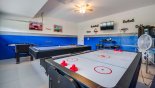 Spacious rental Champions Gate Villa in Orlando complete with stunning Games room with pool table (table tennis), air hockey. table foosball, darts & TV