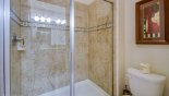 Master 2 ensuite bathroom with large walk-in shower. his & hers sinks & WC - www.iwantavilla.com is the best in Orlando vacation Villa rentals