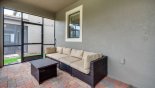 Covered lanai with sectional rattan sofa set - www.iwantavilla.com is your first choice of Villa rentals in Orlando direct with owner