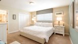 Master bedroom with king sized bed with this Orlando Villa for rent direct from owner
