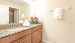 Family bathroom #2 with large walk-in shower, his & hers sinks & WC with this Orlando Villa for rent direct from owner