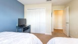 Twin bedroom #2 with large built-in wardrobe from Beach Palm 11 Villa for rent in Orlando