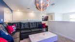 Spacious rental Solterra Resort Villa in Orlando complete with stunning Wrap around sofa seating for 5 people in the entertainment loft